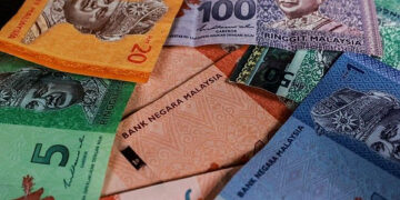 Ringgit ends higher against US dollar ahead of US CPI data