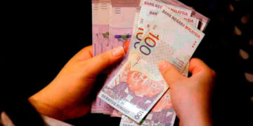 Ringgit open higher vs US dollar as Fed rate hike expectations ease